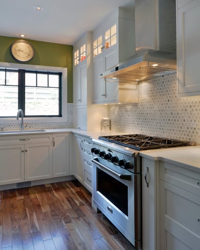 A cabinetry system with undermount and display case lighting.