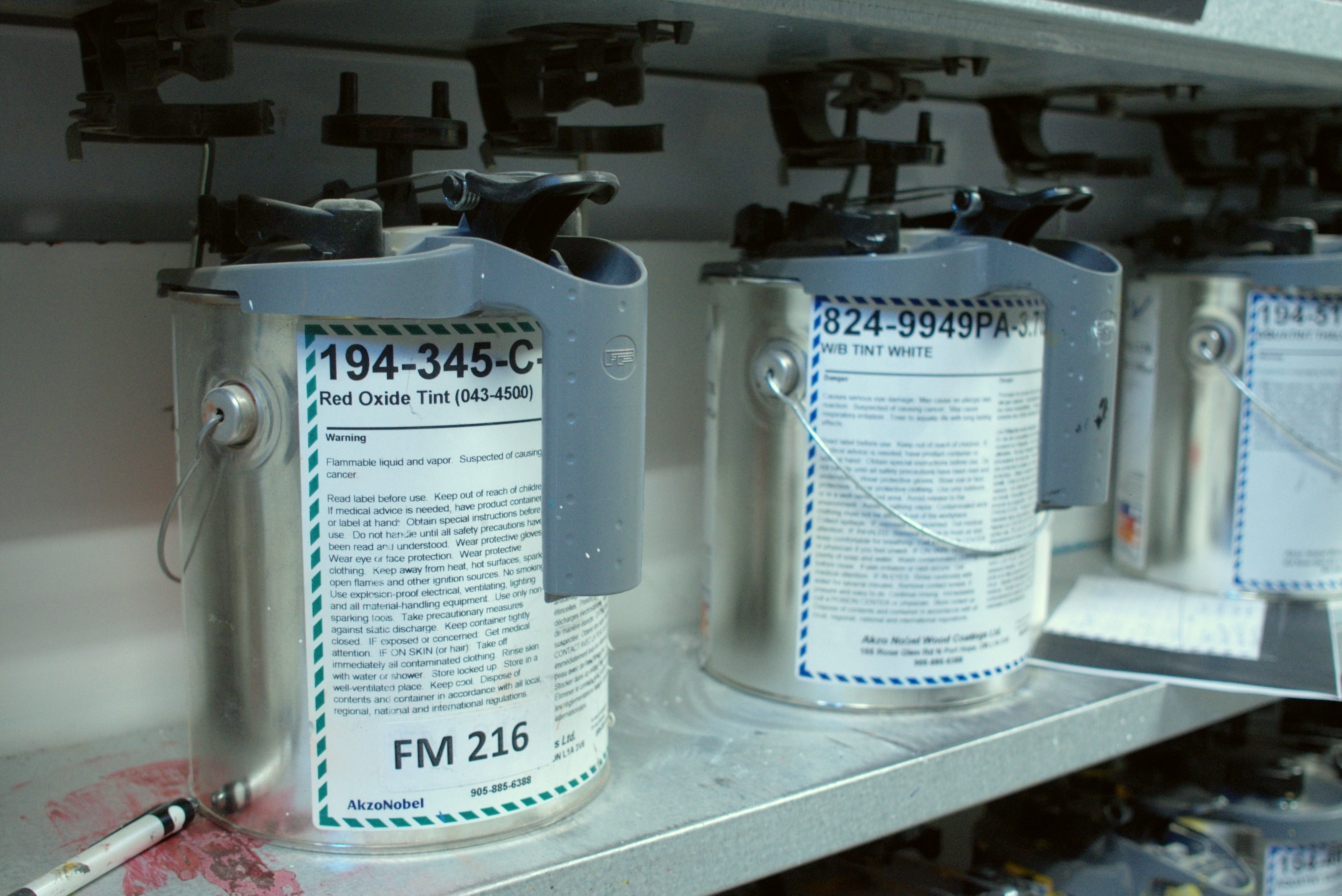 A can of red tint in Deslaurier's colour lab