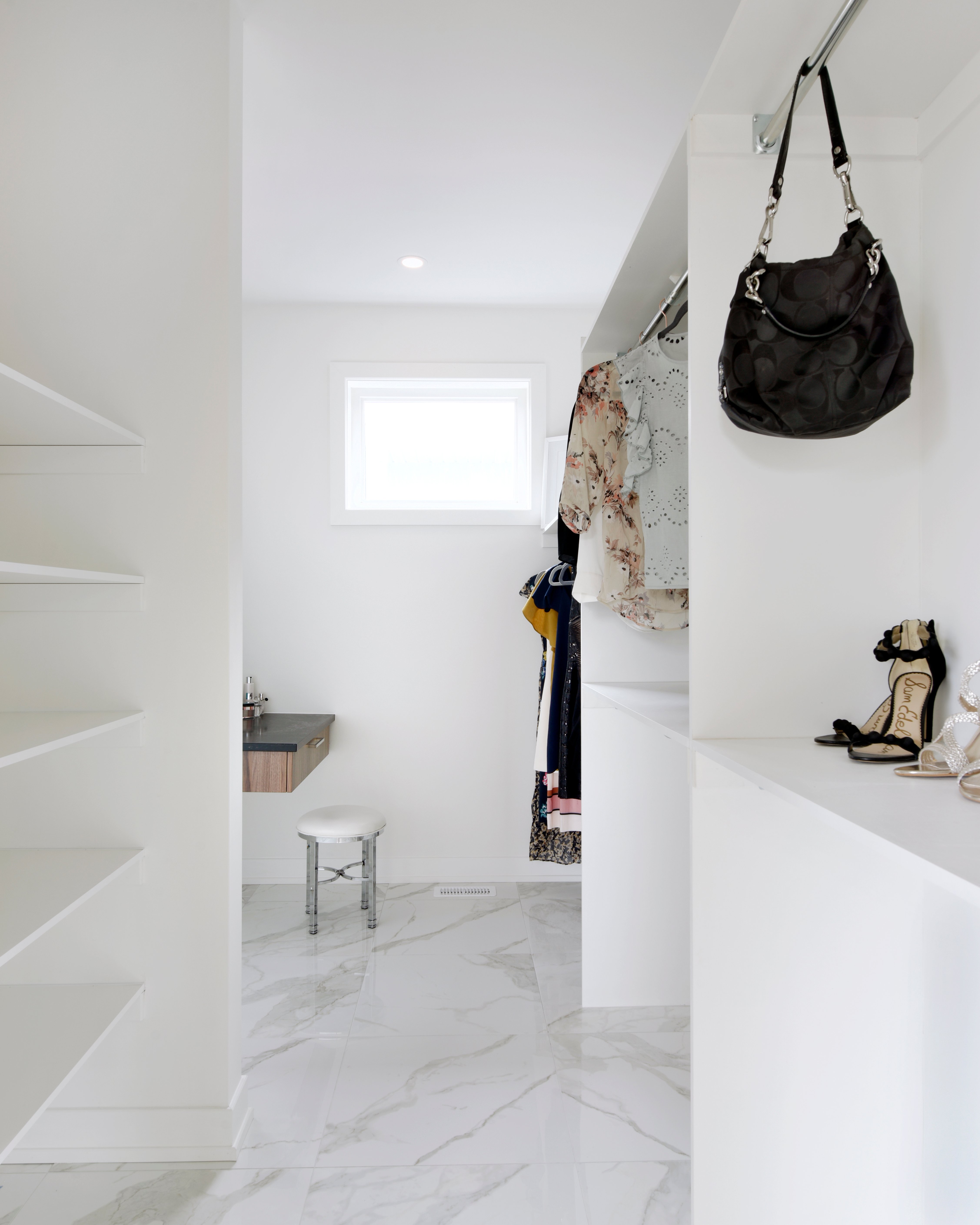 A white custom closet by Deslaurier