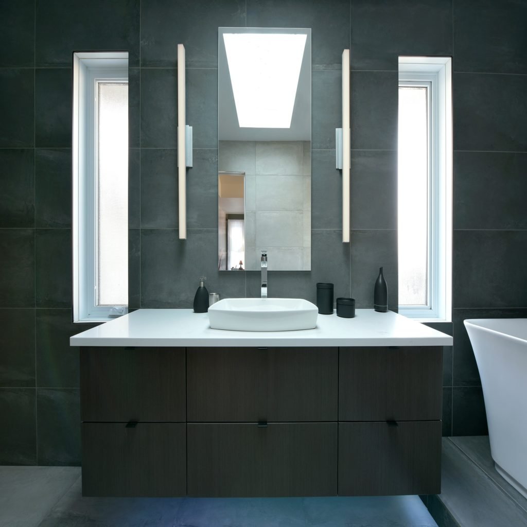 A bathroom vanity with Caesarstone countertops.