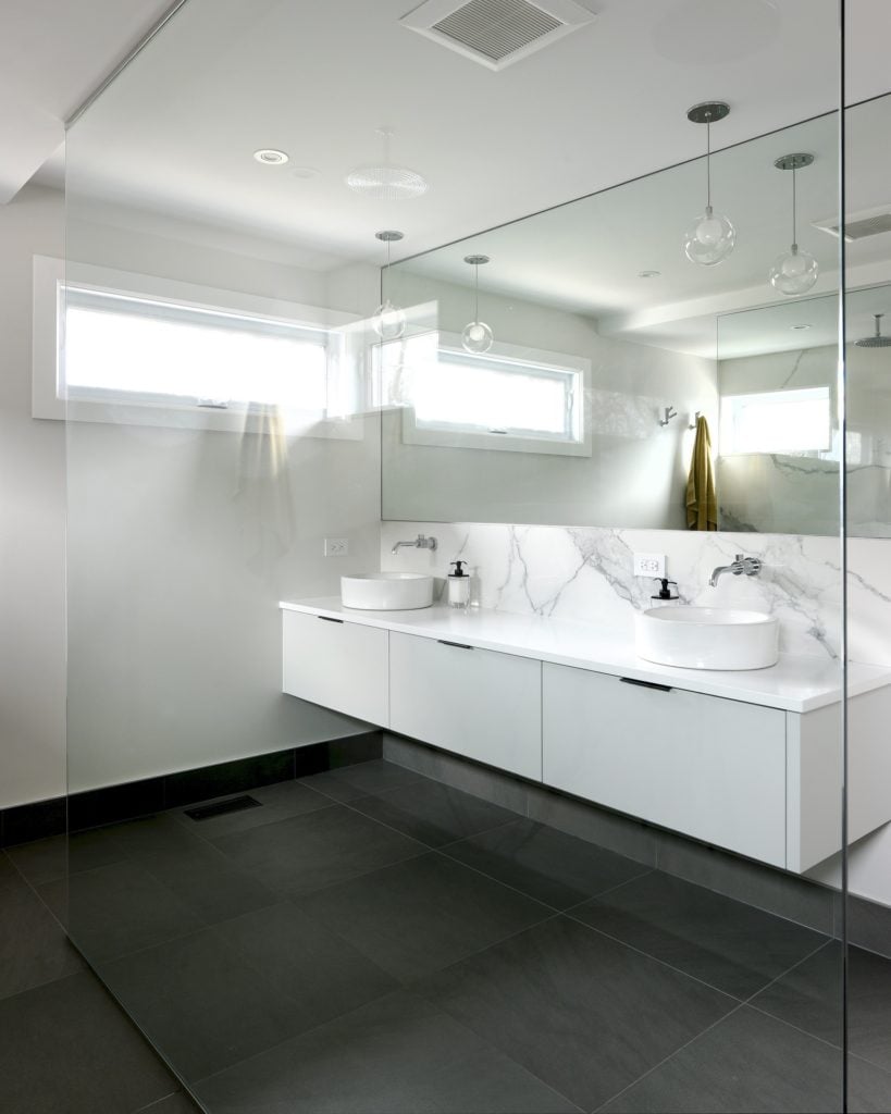 A floating custom double-sink vanity.