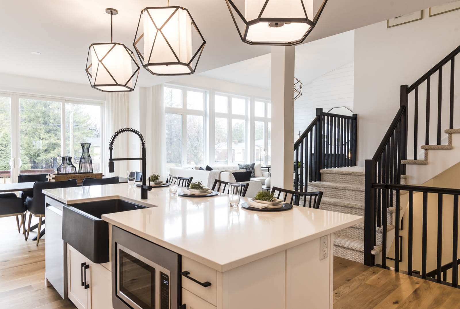 A premium kitchen island with a built-in microwave and apron-front sink