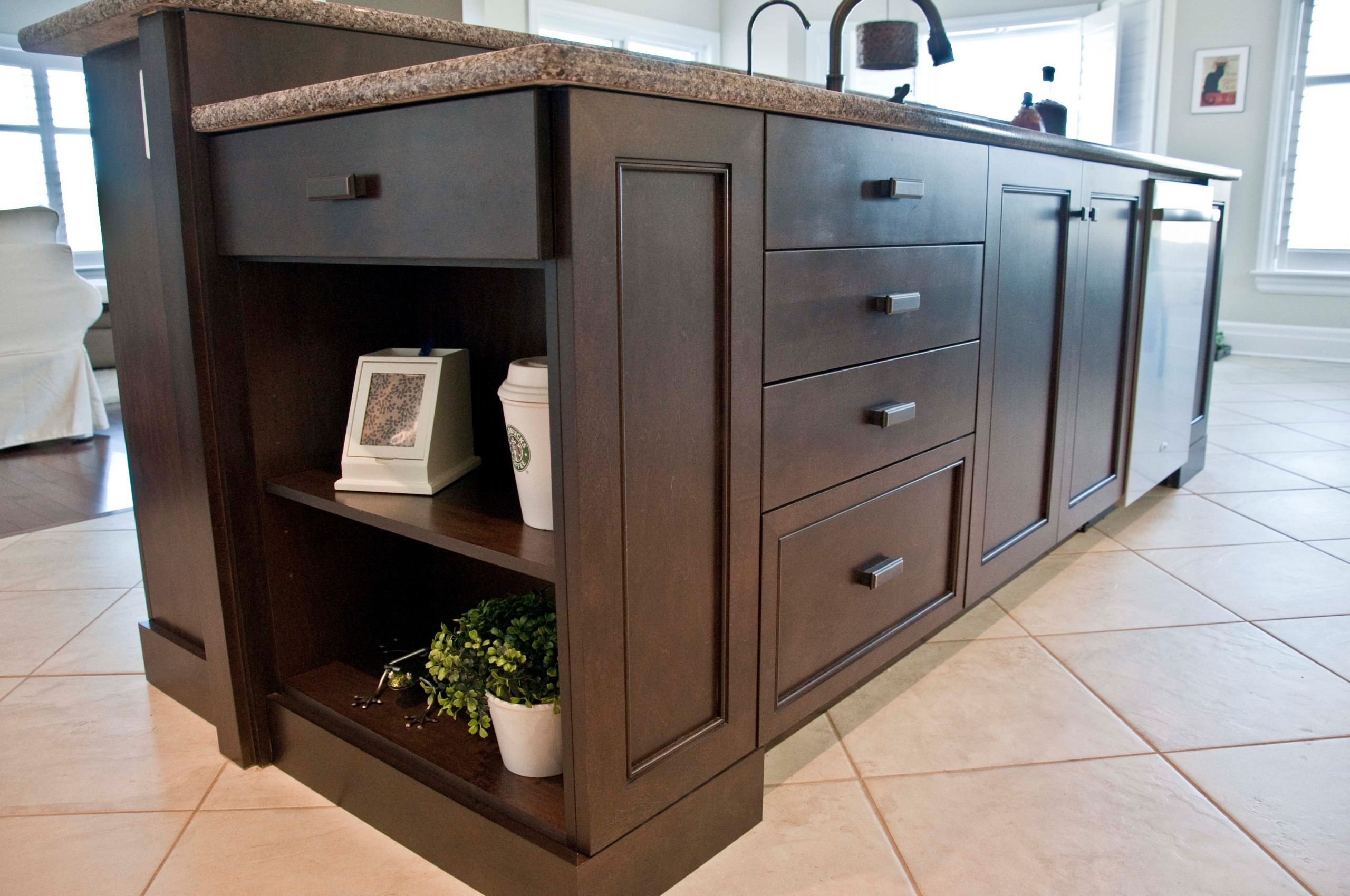 A kitchen island featuring open shelving