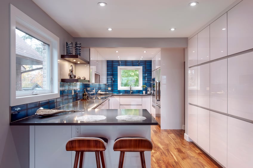 Pot lighting in ceiling of modern kitchen design.