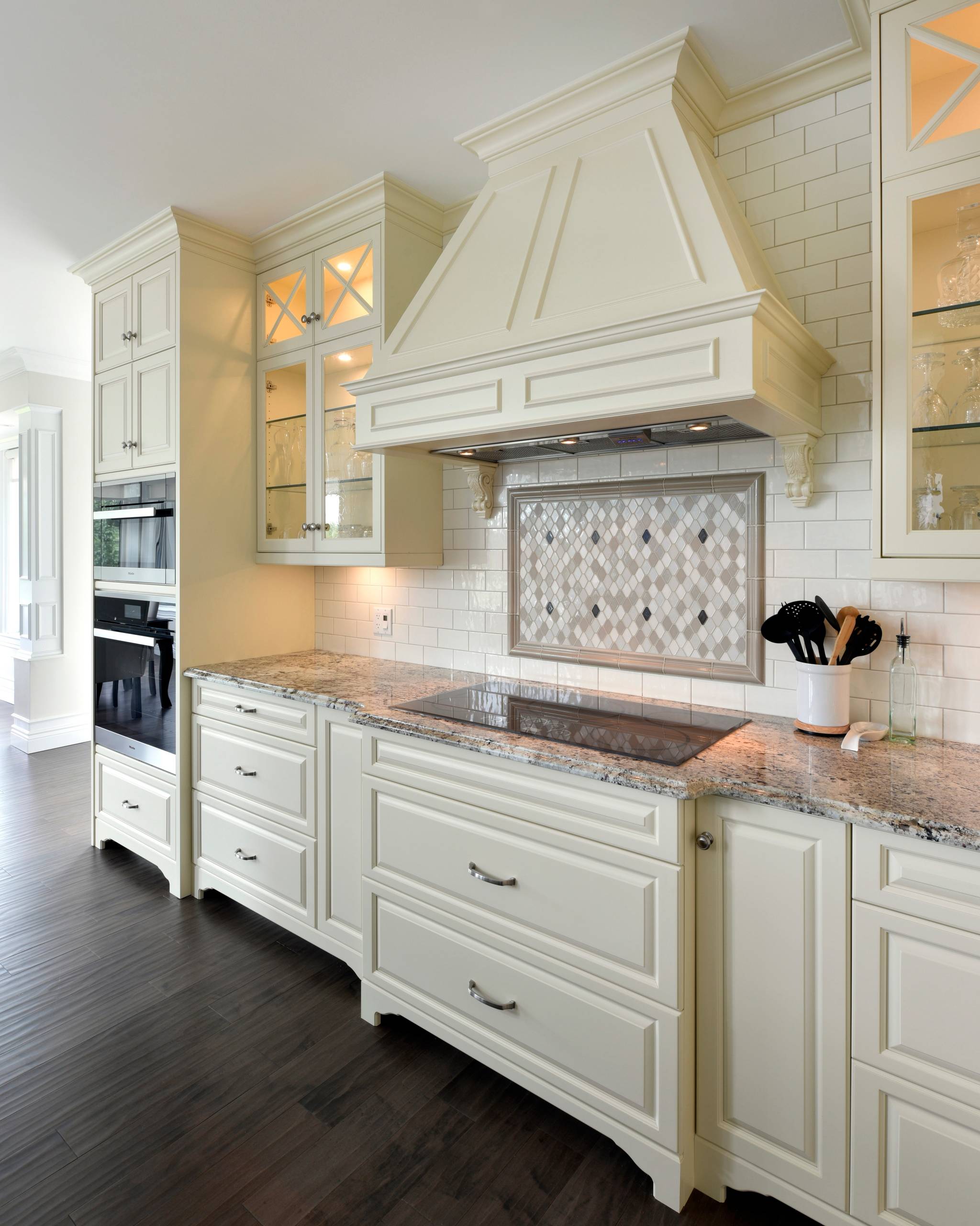 Glass cabinets with glass shelving in a traditional kitchen