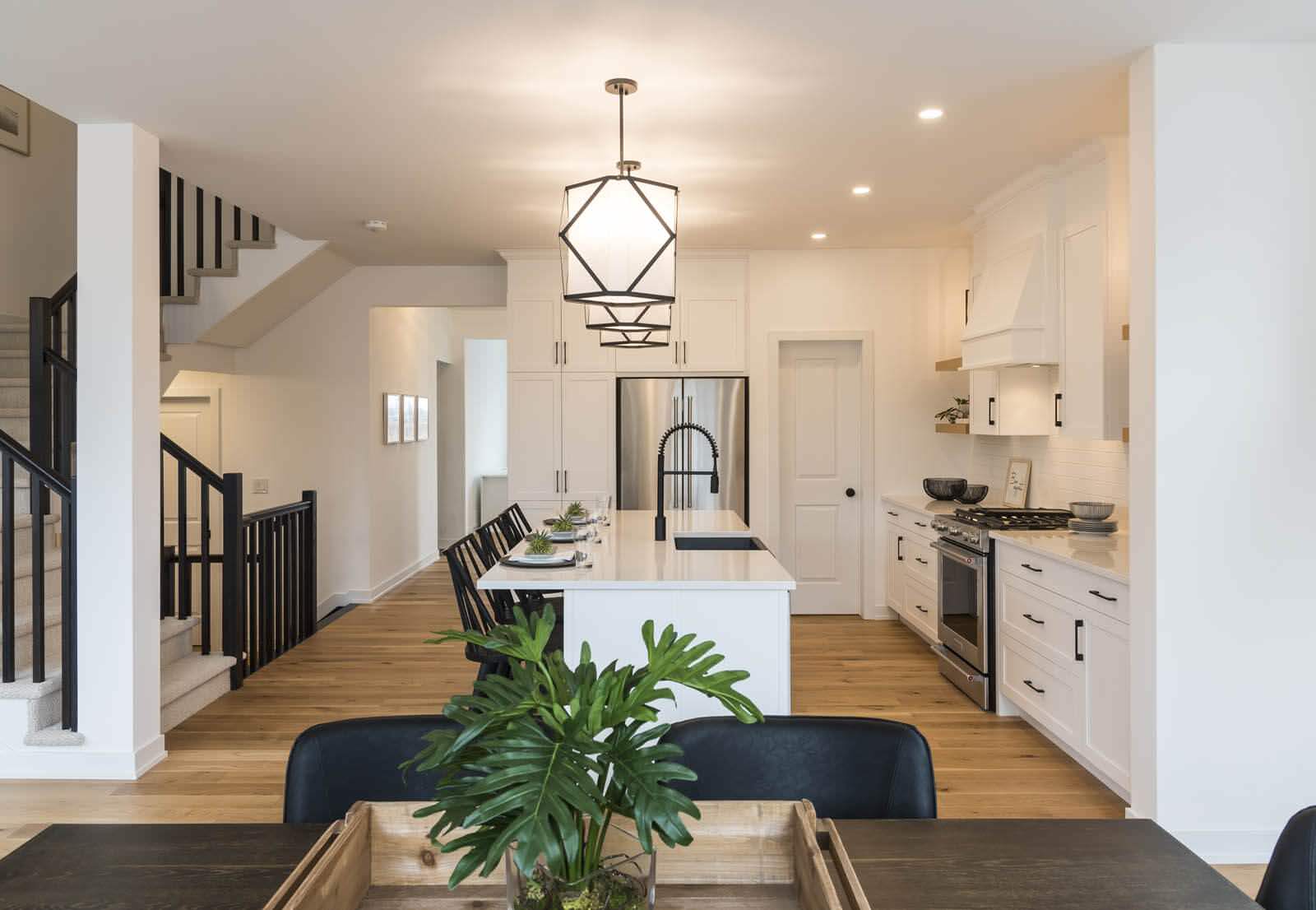 A bright, transitional kitchen space featuring Deslaurier Custom Cabinets