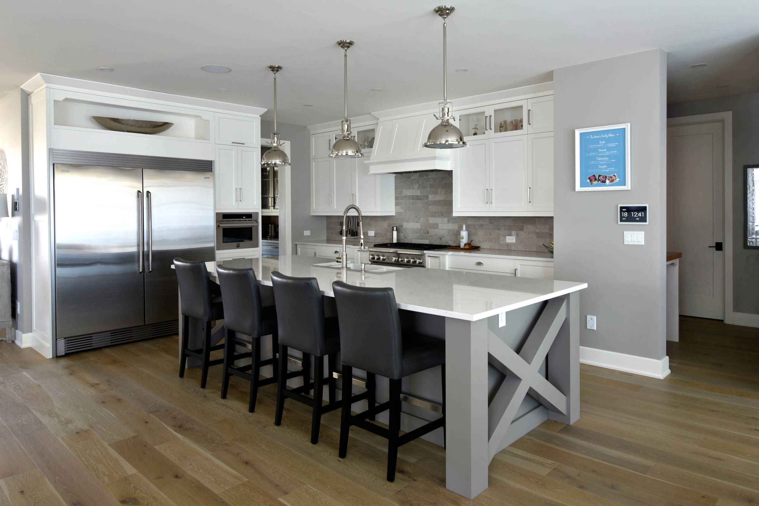 A kitchen island with a cross-pattern end panel