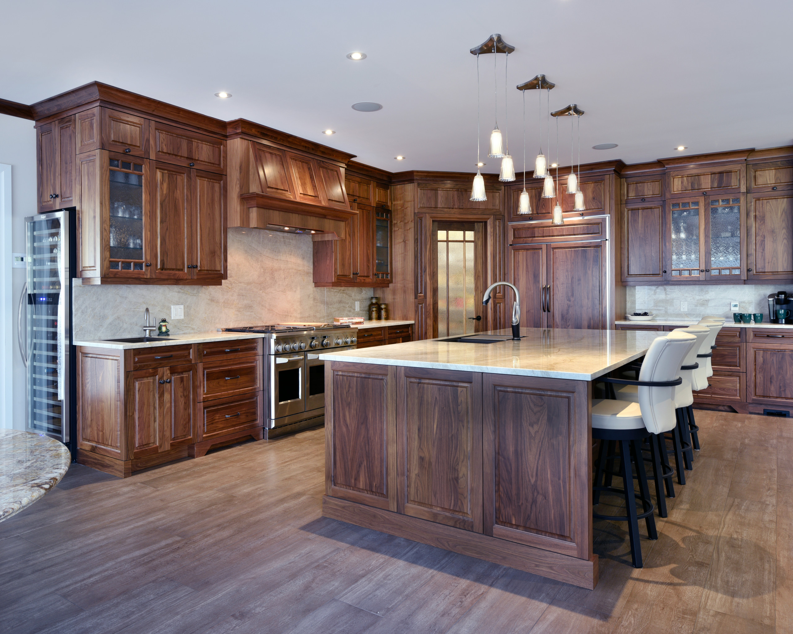 A traditional kitchen design with stained cabinets.