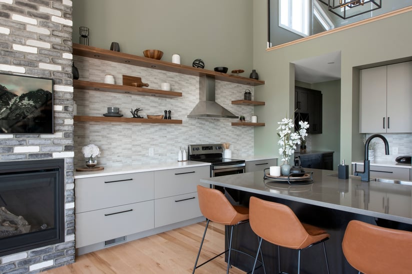 A custom kitchen featuring many open shelves in the place of upper cabinets.