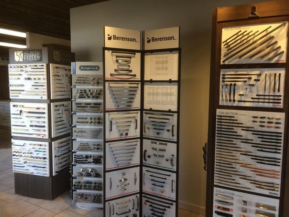 A large display of cabinetry hardware from Deslaurier's showroom.