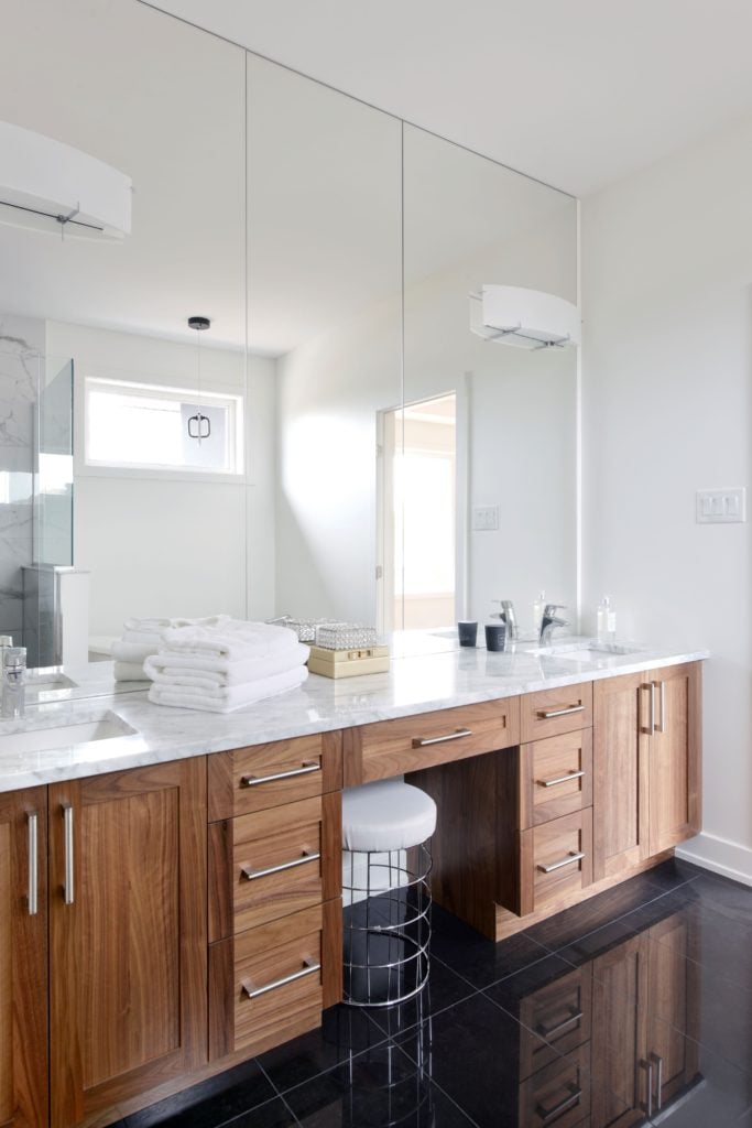 walnut vanity with marble countertops