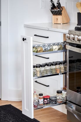 A pull-out spice and oil drawer.