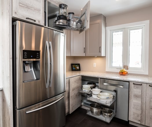 A kitchen featuring corner cabinet accessories.