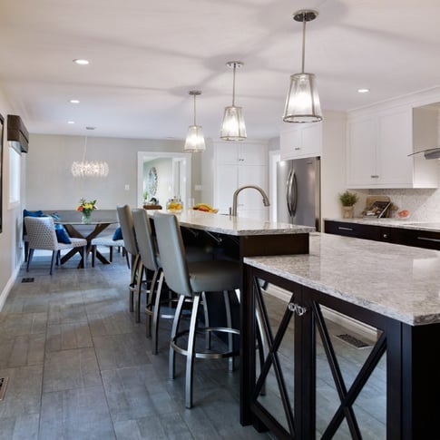 A chic, multi-level kitchen countertop optimizes functionality in the kitchen.