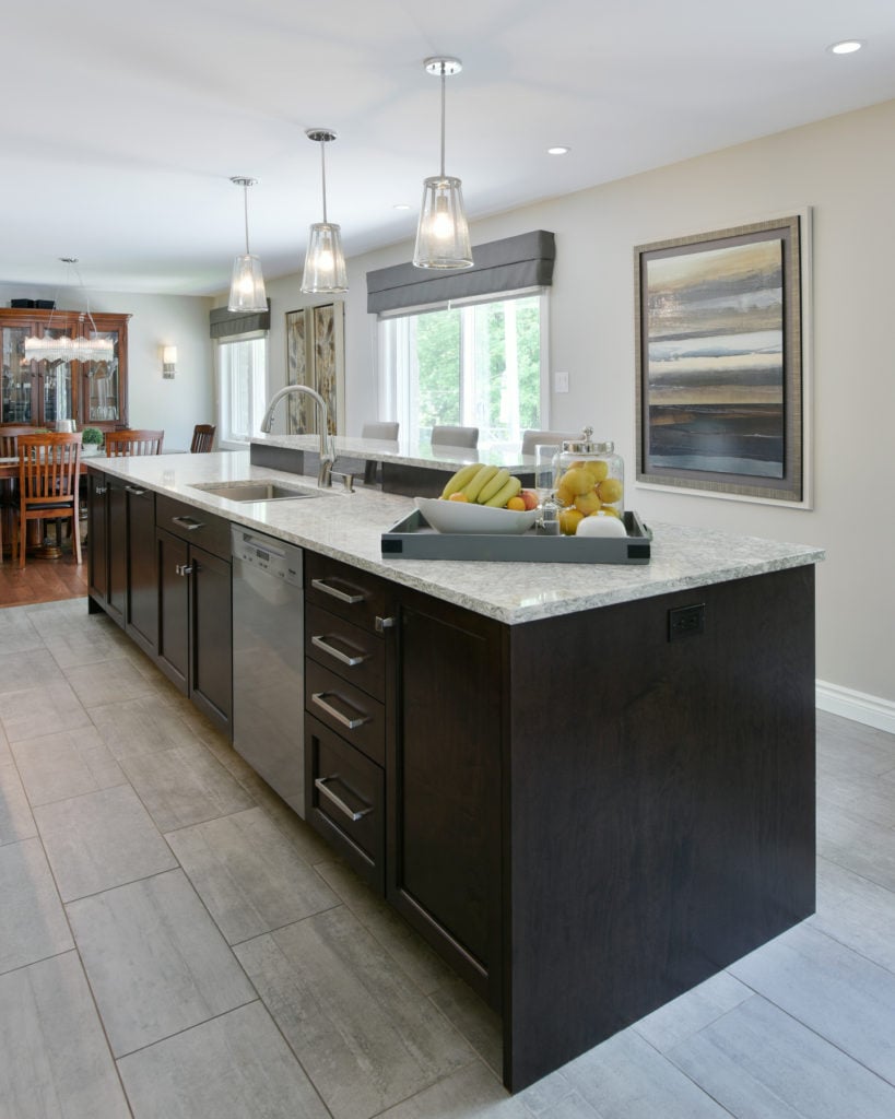 A built-in dishwasher in the base cabinets of a kitchen island.