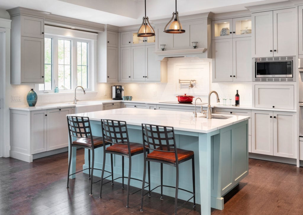 A kitchen design with painted cabinetry