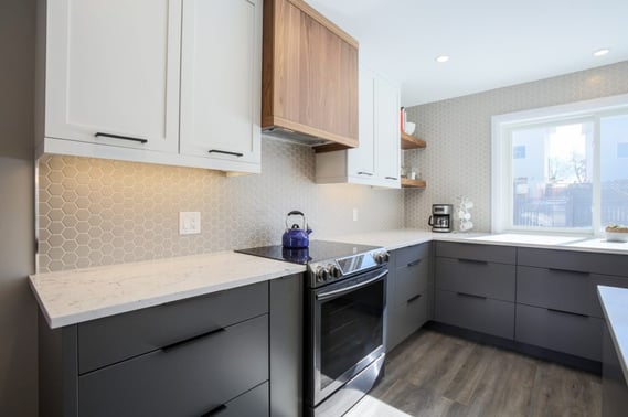 A stunning wood-themed range hood that extends beyond the cabinetry profile.