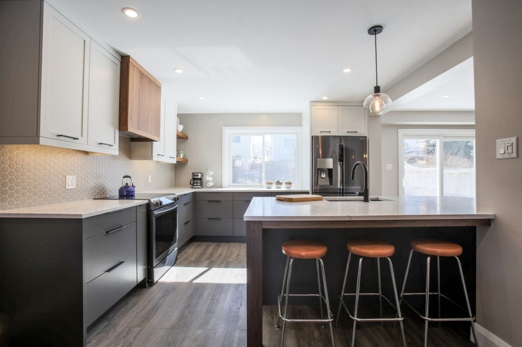 A Deslaurier kitchen design featuring a custom range hood.