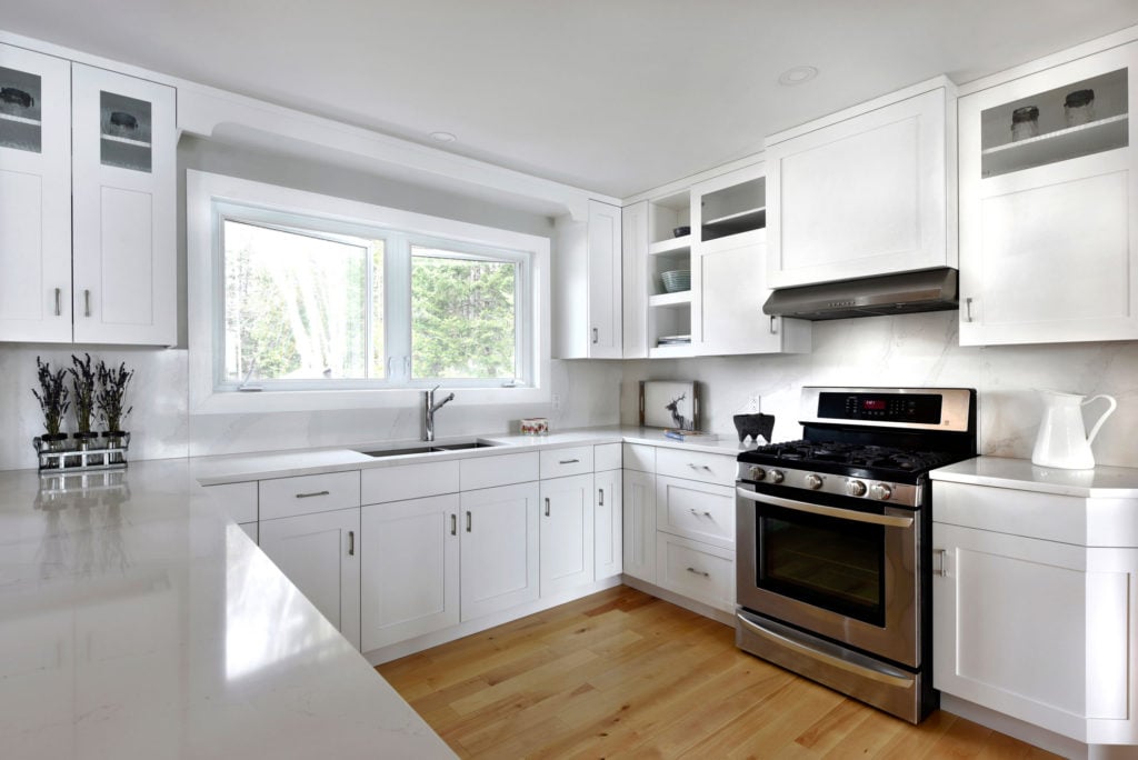 A kitchen design using multi-panel cabinet doors.