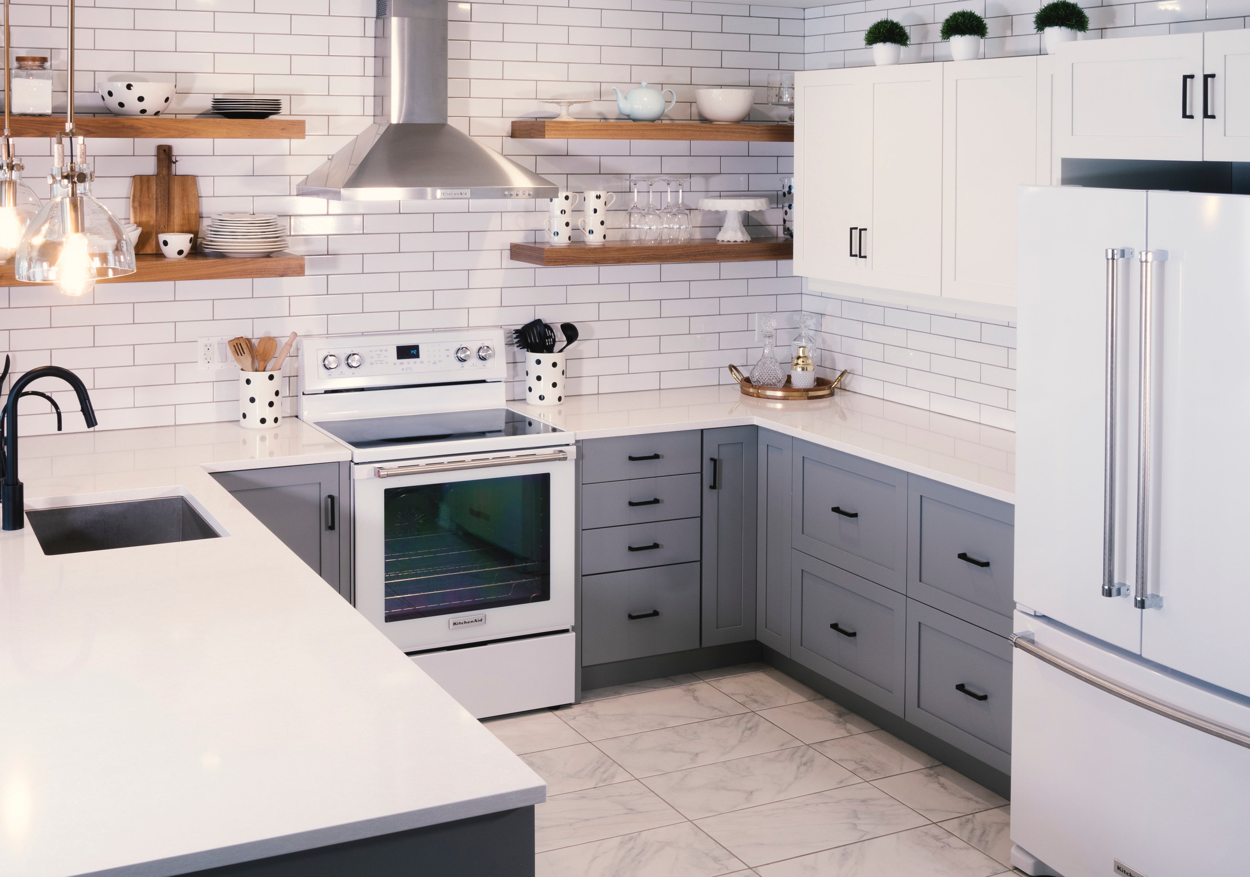 A kitchen design featuring Deslaurier's custom cabinets