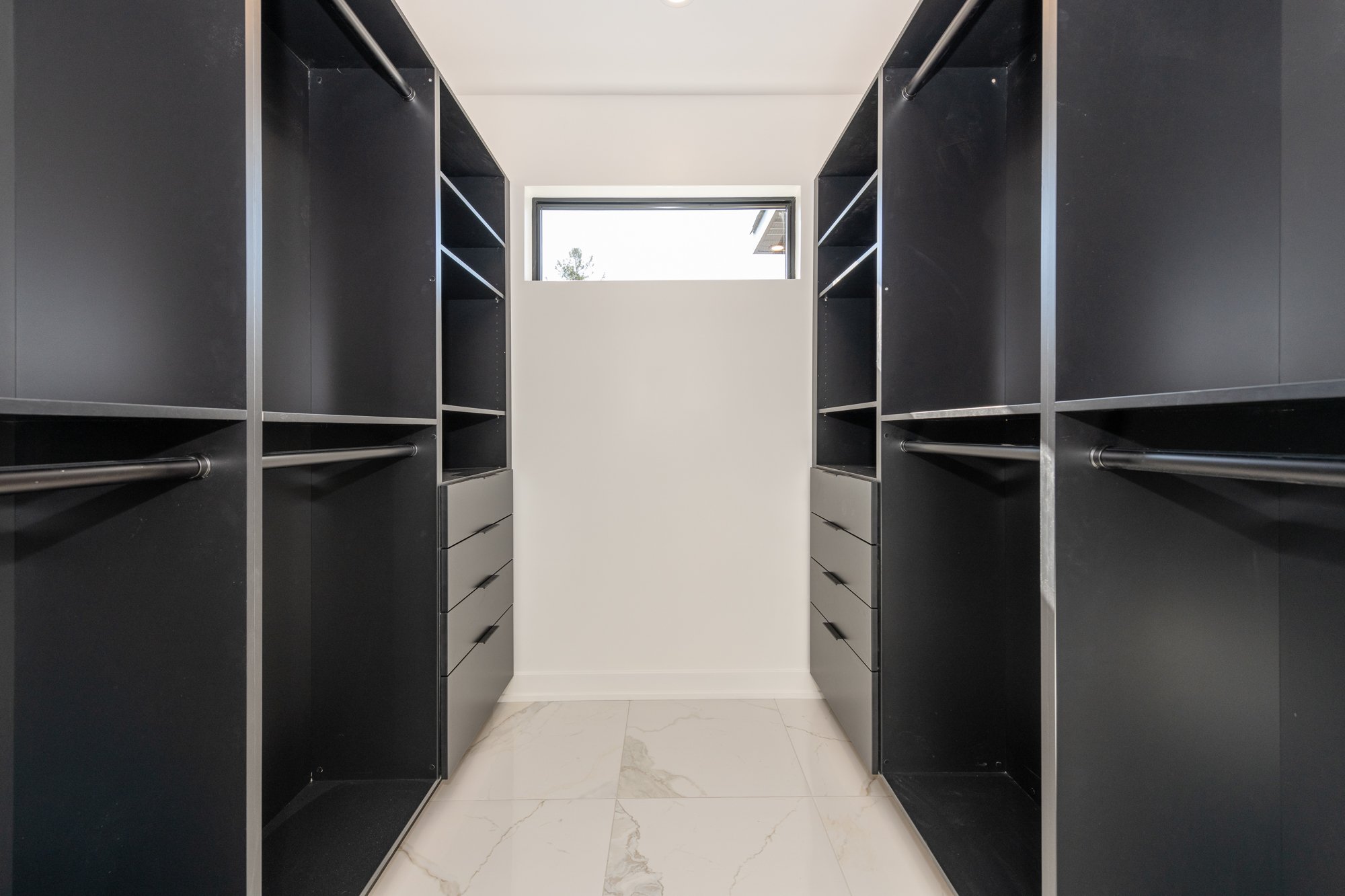 A customized master closet by Deslaurier.