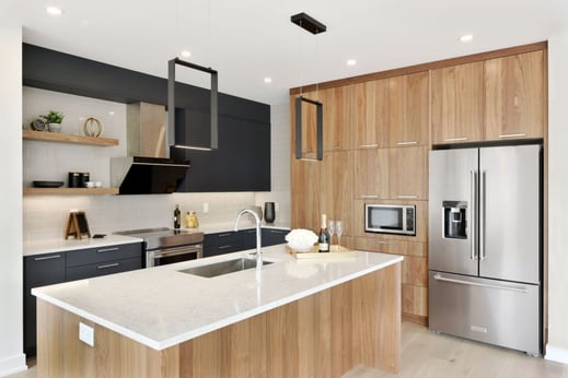 An ultramodern kitchen cabinetry system with flat doors.