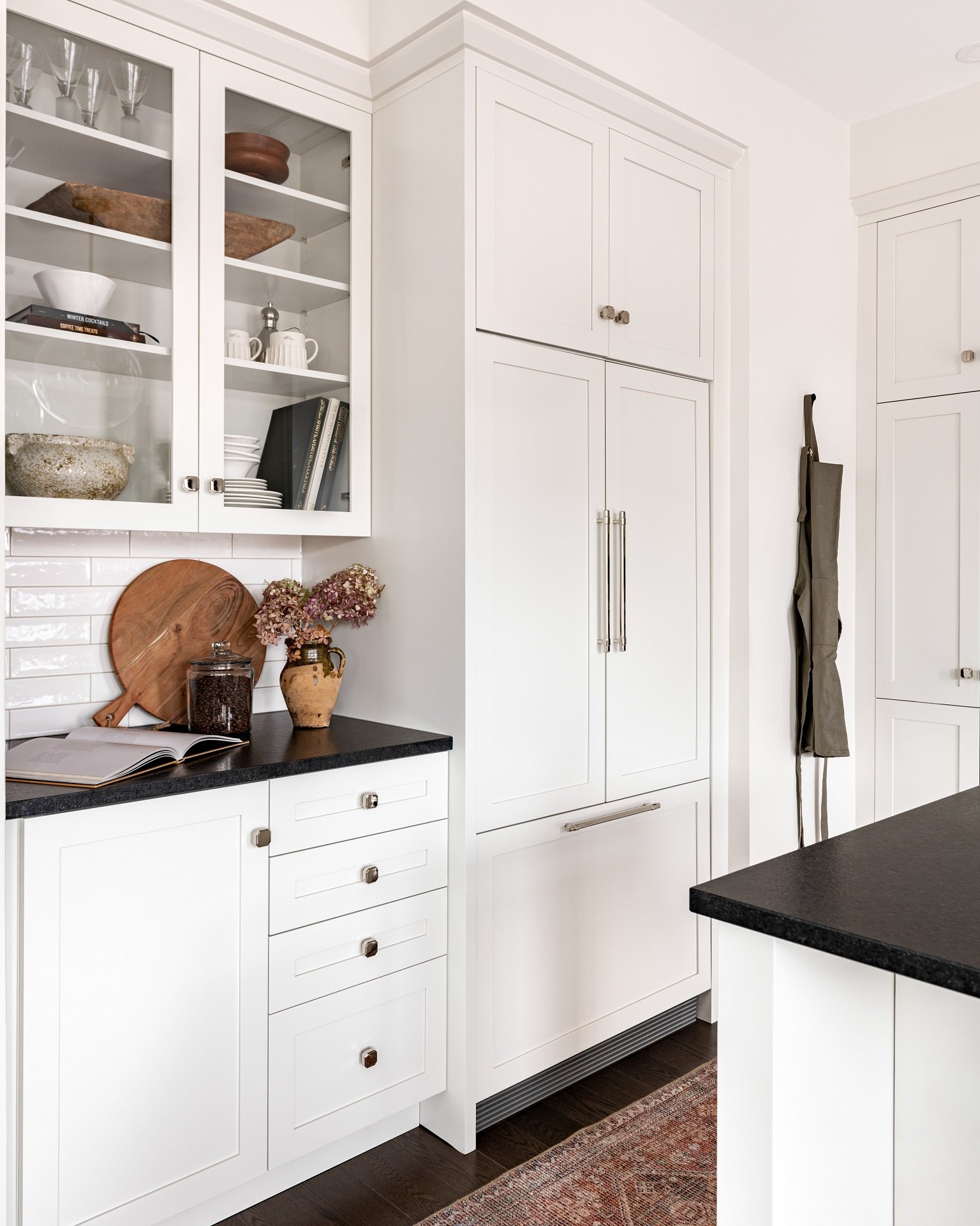 White glass cabinets with white interior shelving