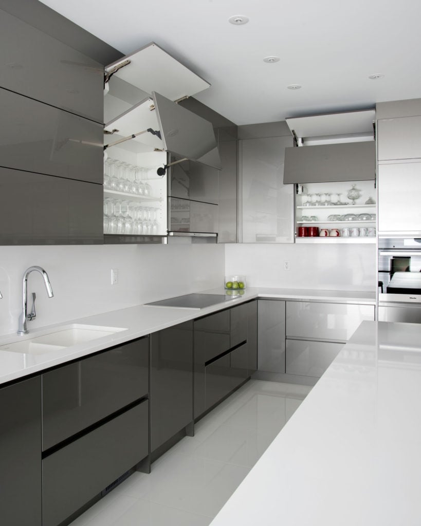An ultra-modern kitchen with tip-on upper cabinets.