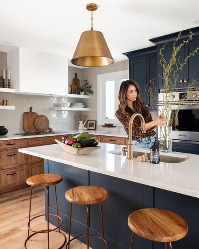 Natural wood hues and navy blue make a perfect pair in this kitchen.