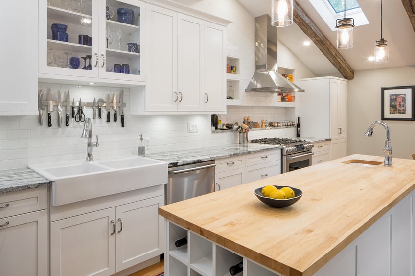A clean-cut kitchen design warmed with a maple butcher block surface.