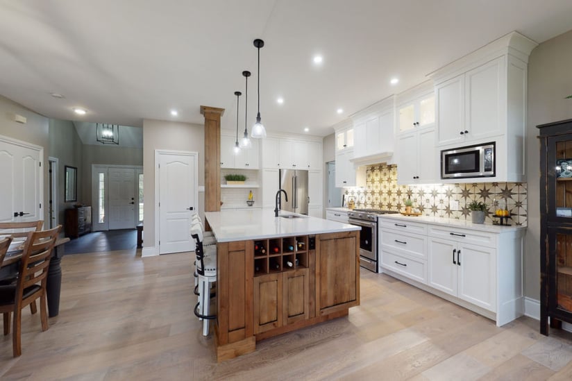 A modern-farmhouse kitchen with interior glass cabinet and under cabinet lighting.