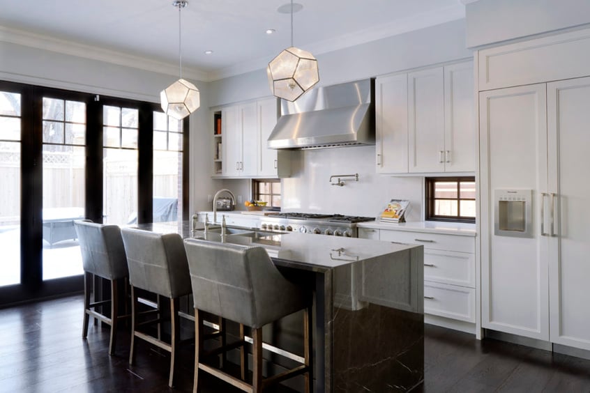Dark marble countertops raise the aesthetic appeal of a kitchen space.