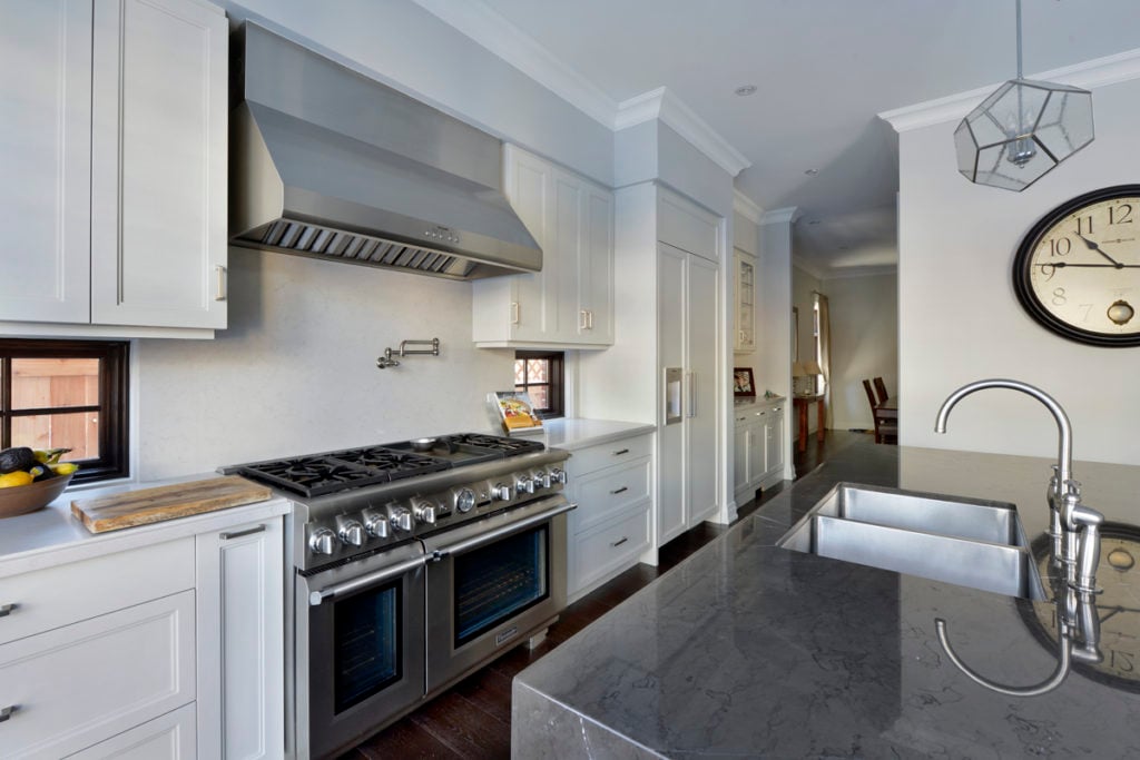 A high-end kitchen featuring industrial-style appliances.