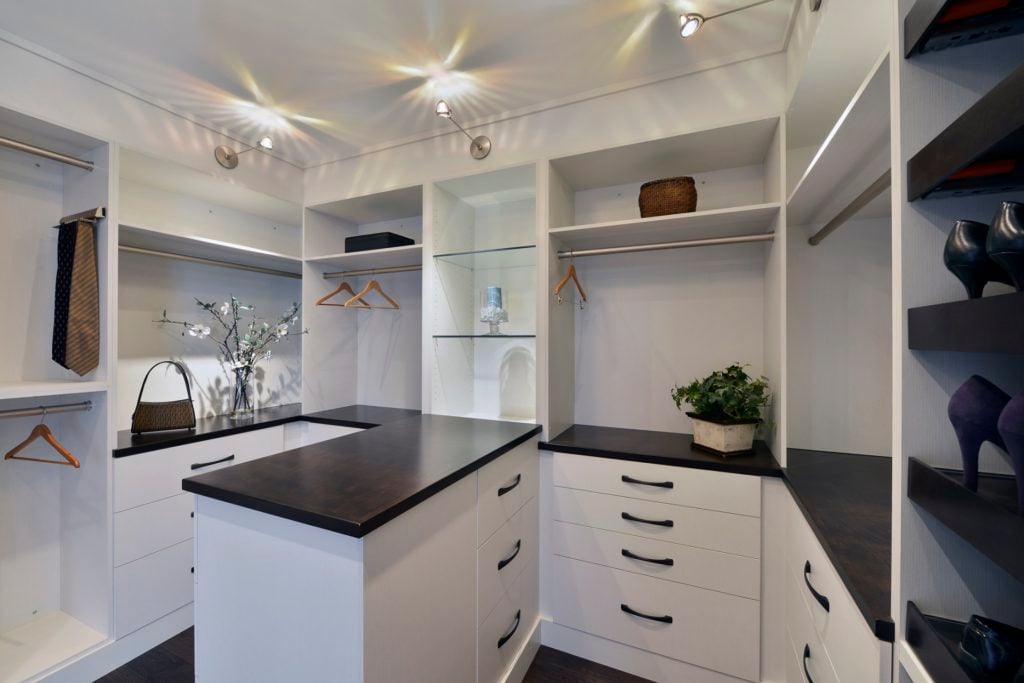 A custom closet with ample countertop space.