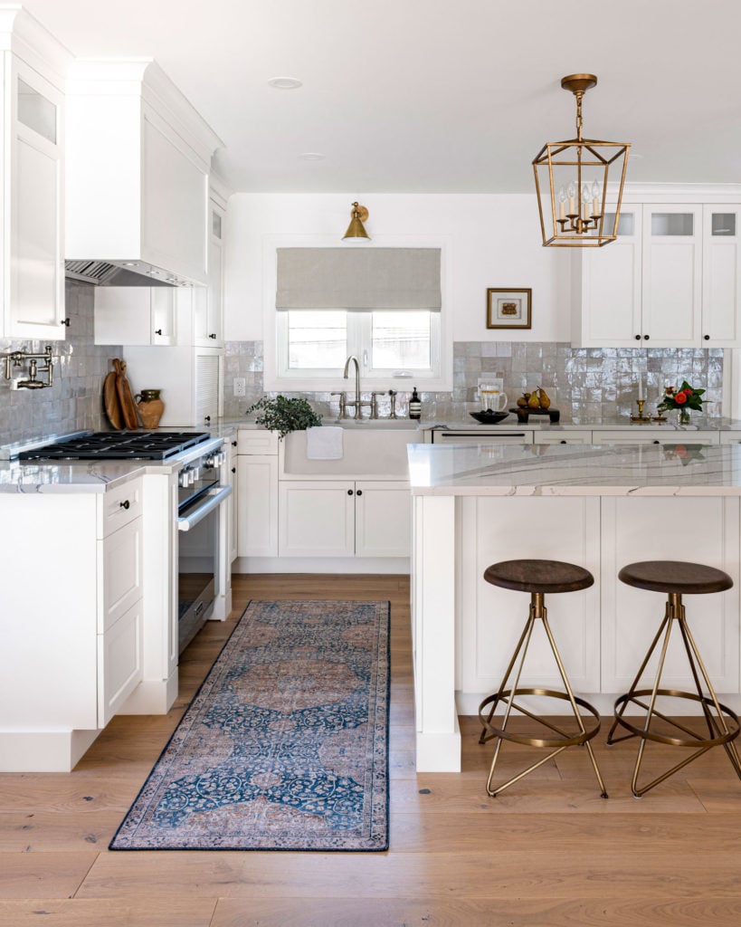A modern kitchen design with farmhouse elements.