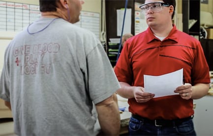 Two construction professionals in conversation.